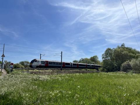 Photograph of a Greater Anglia train in the countryside