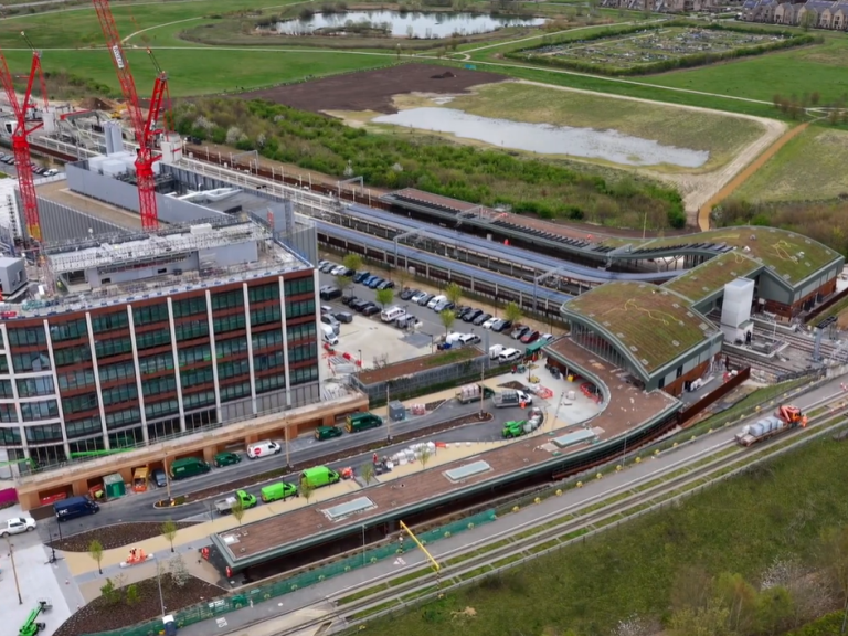 Aerial photograph of Cambridge South Station with Hobson's Park in the background