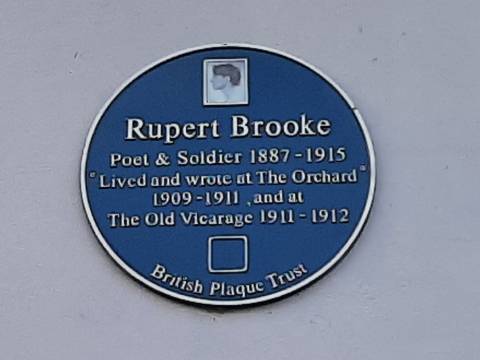 Photograph of the blue plaque to Rupert Brooke. The inscription reads "Lived and wrote at The Orchard109-1911 and at The Old Vicarage 1911-1912."